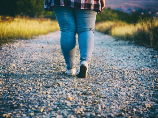 Young woman walking on country road